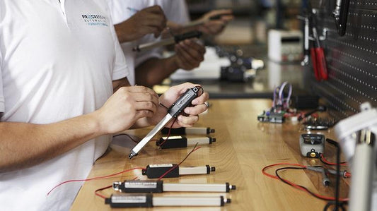 Photo of a man testing a linear actuator
