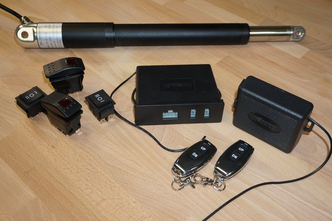 Photo of a linear actuator, control box and remote control by Progressive Automations