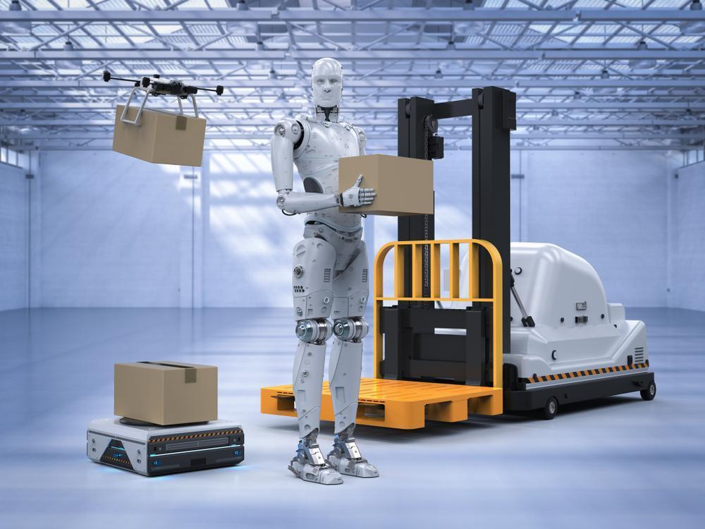 Photo of a robot holding box near a forklift
